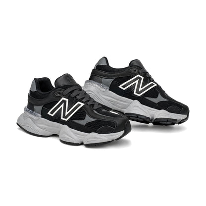 New Balance 9060 color negro — par en vista 3D, fondo blanco